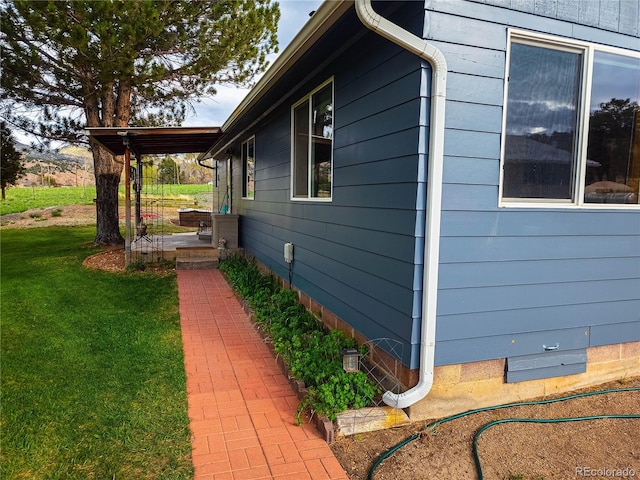 view of property exterior featuring a lawn