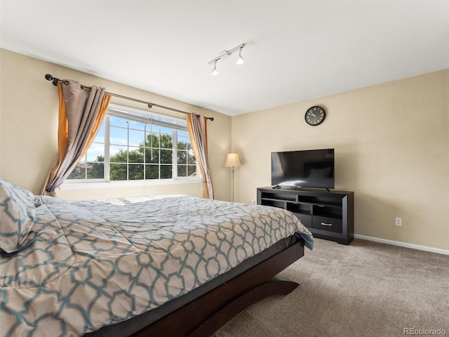 18554 E Vassar Dr, Aurora, CO 80013 - carpeted bedroom featuring baseboards and track lighting