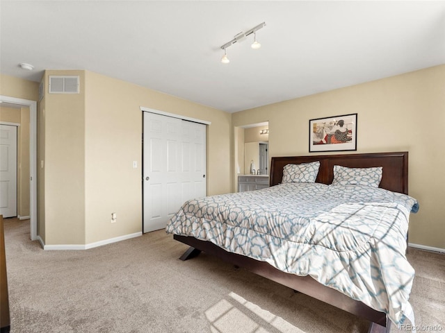 18554 E Vassar Dr, Aurora, CO 80013 - carpeted bedroom featuring track lighting and a closet