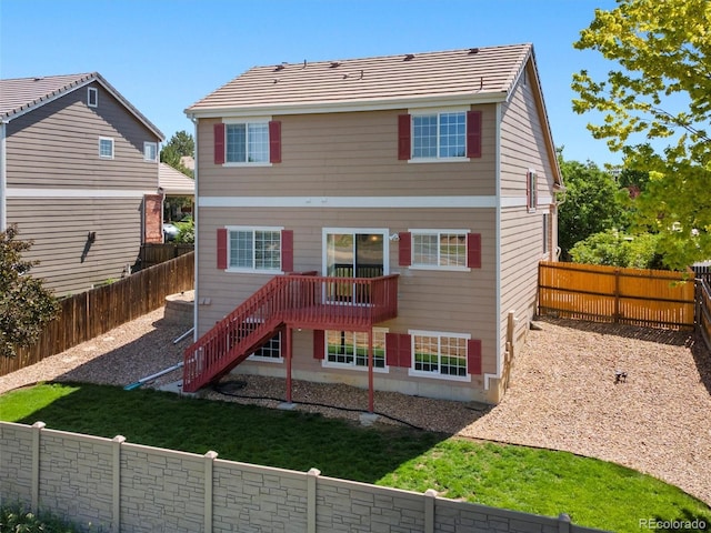 18554 E Vassar Dr, Aurora, CO 80013 - rear view of house featuring stairway and a fenced backyard