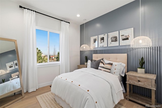 bedroom with light hardwood / wood-style flooring