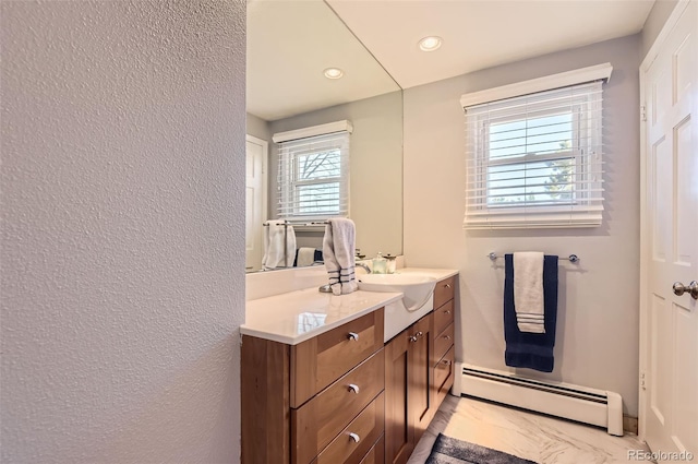 bathroom with a baseboard radiator and vanity