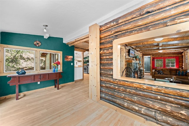 5732 Santa Clara Rd, Indian Hills, CO 80454 - interior space featuring rustic walls, wood finished floors, and stainless steel gas range