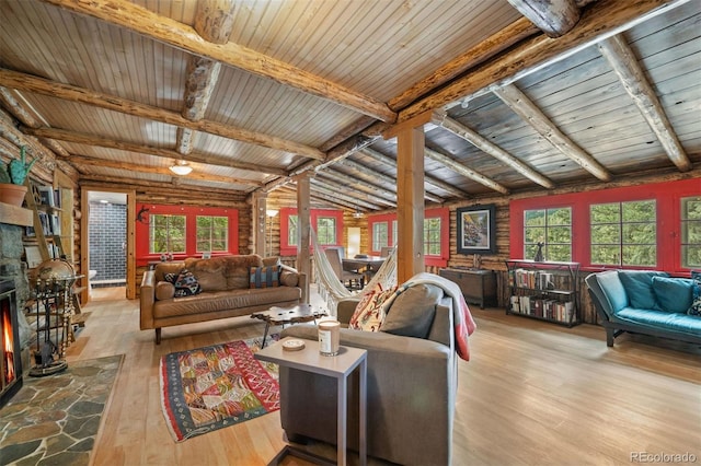 5732 Santa Clara Rd, Indian Hills, CO 80454 - living room featuring wood-type flooring, a stone fireplace, and wood ceiling