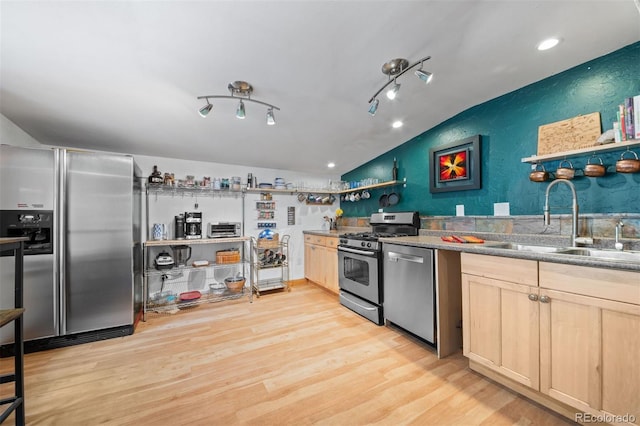 5732 Santa Clara Rd, Indian Hills, CO 80454 - kitchen with appliances with stainless steel finishes, light brown cabinetry, light wood-style floors, vaulted ceiling, and recessed lighting