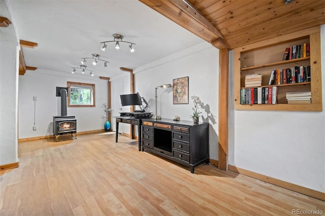 5732 Santa Clara Rd, Indian Hills, CO 80454 - home office featuring a wood stove and wood finished floors