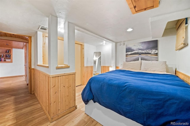 5732 Santa Clara Rd, Indian Hills, CO 80454 - bedroom with light wood-type flooring, wainscoting, wooden walls, and recessed lighting