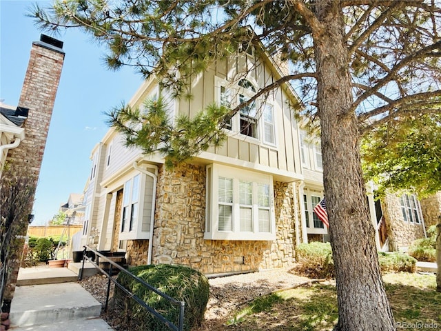 1120 S Waco St Unit A, Aurora, CO 80017 - view of property exterior featuring stone siding and board and batten siding