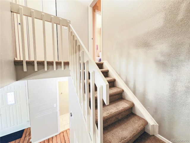1120 S Waco St Unit A, Aurora, CO 80017 - stairway featuring wood finished floors