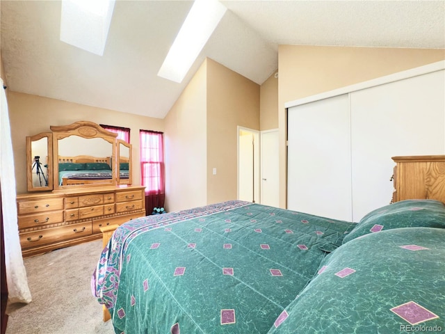 1120 S Waco St Unit A, Aurora, CO 80017 - bedroom with carpet floors, vaulted ceiling, a skylight, and a closet