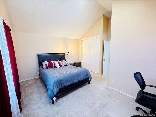 1120 S Waco St Unit A, Aurora, CO 80017 - bedroom featuring carpet floors, lofted ceiling, and baseboards