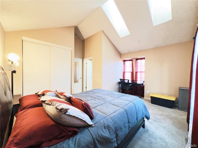 1120 S Waco St Unit A, Aurora, CO 80017 - bedroom with a skylight, carpet flooring, lofted ceiling, and a closet