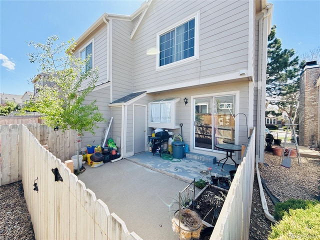 1120 S Waco St Unit A, Aurora, CO 80017 - back of property featuring a patio area and fence