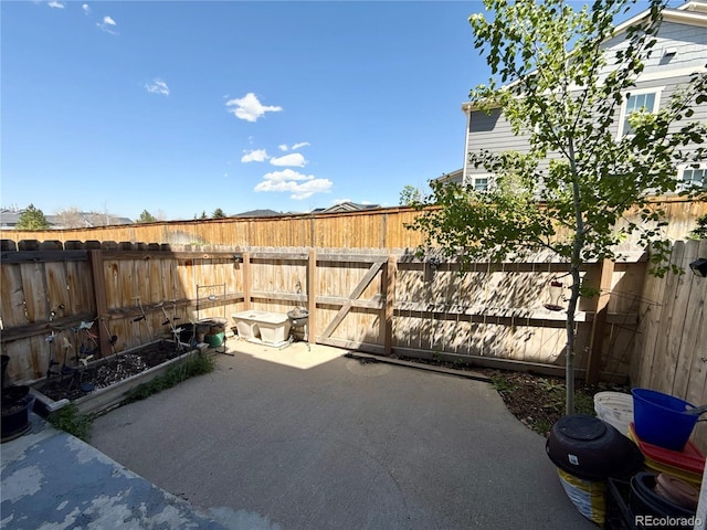 1120 S Waco St Unit A, Aurora, CO 80017 - view of patio with a fenced backyard