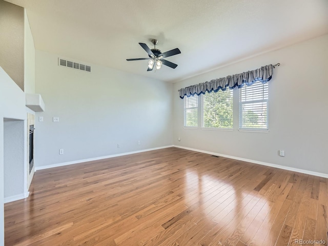 581 N Flat Rock Cir, Aurora, CO 80018 - unfurnished living room featuring ceiling fan and wood finished floors