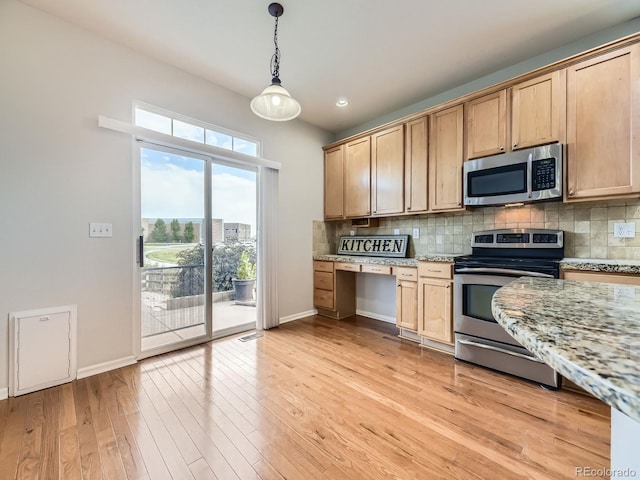 581 N Flat Rock Cir, Aurora, CO 80018 - kitchen with appliances with stainless steel finishes, decorative backsplash, light wood-style floors, light stone counters, and hanging light fixtures