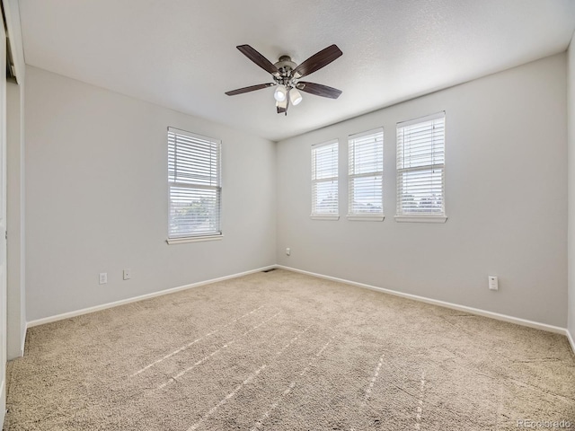 581 N Flat Rock Cir, Aurora, CO 80018 - carpeted spare room featuring plenty of natural light and a ceiling fan