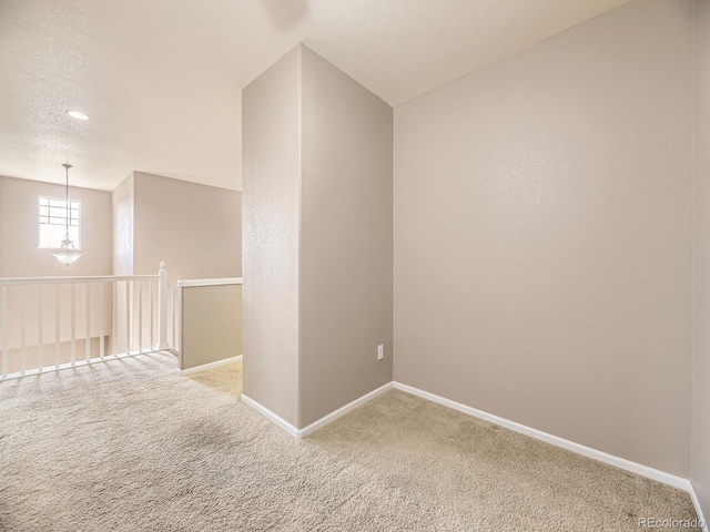 581 N Flat Rock Cir, Aurora, CO 80018 - unfurnished room with carpet flooring and a textured ceiling
