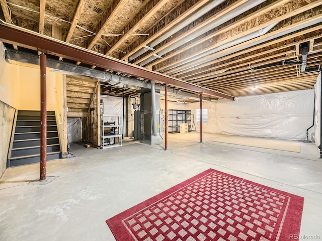 581 N Flat Rock Cir, Aurora, CO 80018 - unfinished basement with stairs and water heater