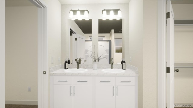 46517 Sunflower Ln, Bennett, CO 80102 - bathroom featuring double vanity, baseboards, and a sink