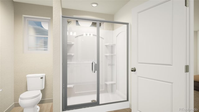 46517 Sunflower Ln, Bennett, CO 80102 - bathroom with baseboards, toilet, wood finished floors, and a shower stall