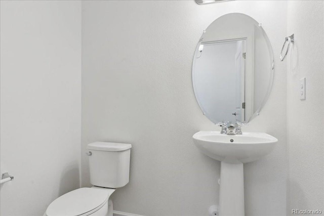 6902 Huddersfield Ln, Castle Pines, CO 80108 - half bathroom with toilet and a sink