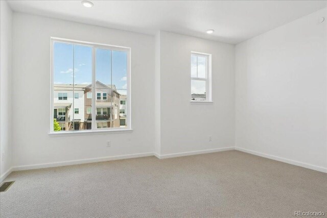 6902 Huddersfield Ln, Castle Pines, CO 80108 - spare room with light carpet, baseboards, and recessed lighting