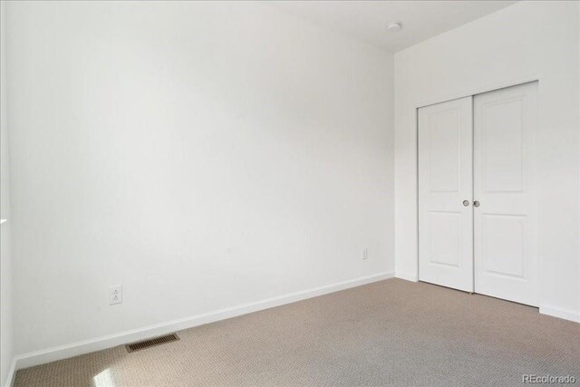 6902 Huddersfield Ln, Castle Pines, CO 80108 - unfurnished bedroom featuring carpet floors, baseboards, and a closet