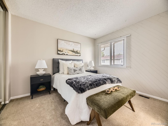 1932 S Oswego Way, Aurora, CO 80014 - bedroom featuring carpet floors, a textured ceiling, and baseboards