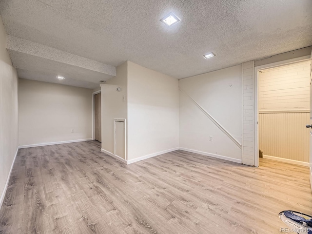 1932 S Oswego Way, Aurora, CO 80014 - finished basement with a textured ceiling, wood finished floors, and baseboards