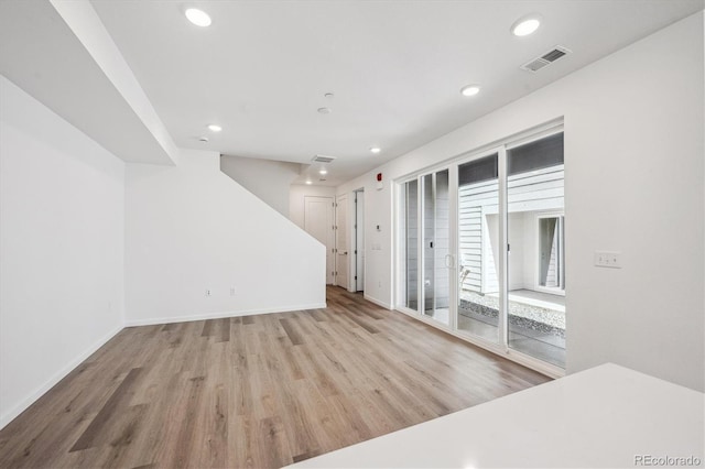 1368 Penner Dr, Erie, CO 80026 - unfurnished living room with wood finished floors, recessed lighting, and baseboards