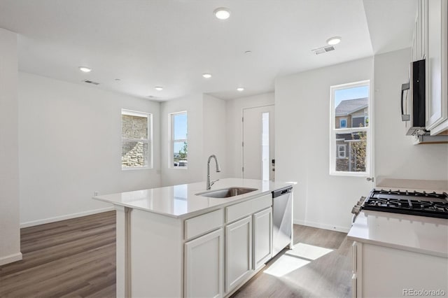 1368 Penner Dr, Erie, CO 80026 - kitchen with a sink, healthy amount of natural light, light wood-style flooring, stainless steel appliances, and recessed lighting