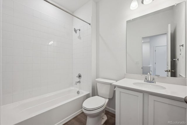 1368 Penner Dr, Erie, CO 80026 - full bath featuring toilet, bathing tub / shower combination, vanity, and wood finished floors
