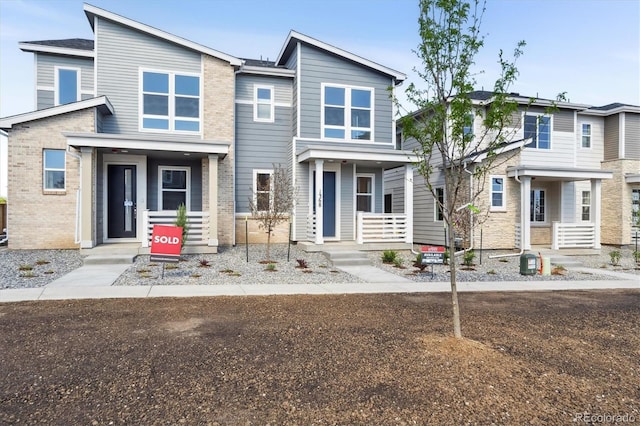 1368 Penner Dr, Erie, CO 80026 - view of front facade featuring covered porch