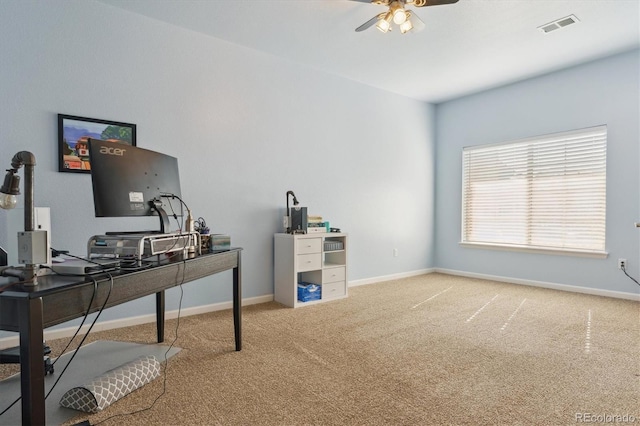 office space featuring carpet, ceiling fan, and baseboards