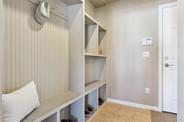 mudroom featuring tile patterned floors and baseboards