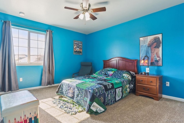 carpeted bedroom with baseboards and ceiling fan