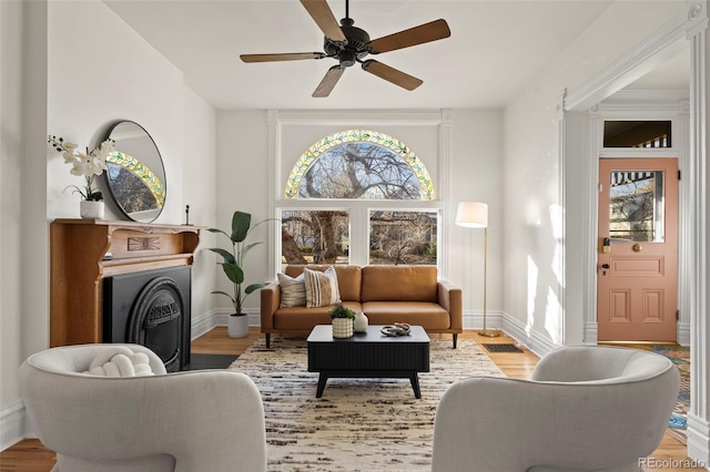 sitting room featuring light hardwood / wood-style flooring and ceiling fan