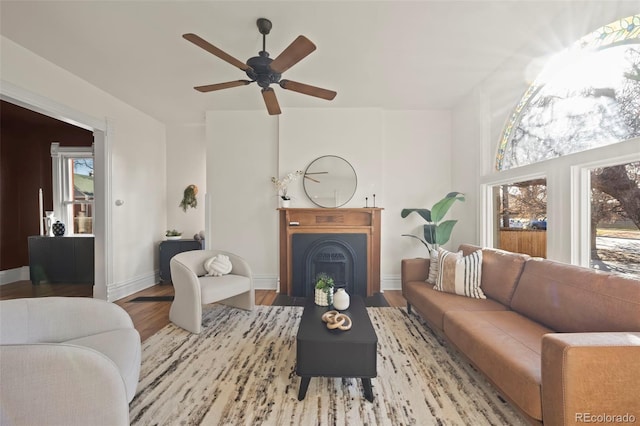 living room with hardwood / wood-style flooring and ceiling fan