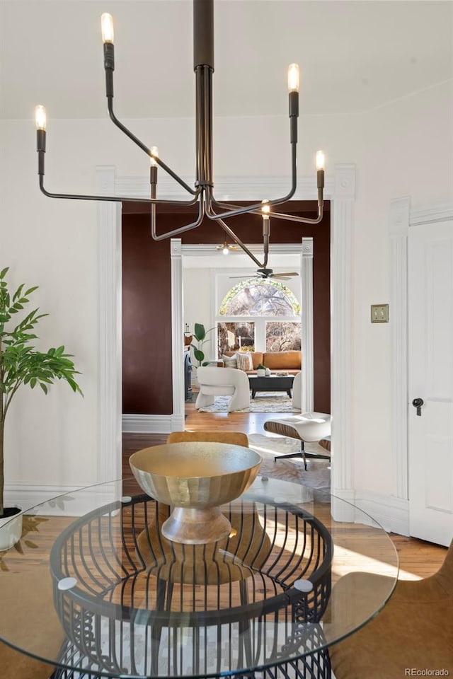 dining space with a chandelier and hardwood / wood-style floors