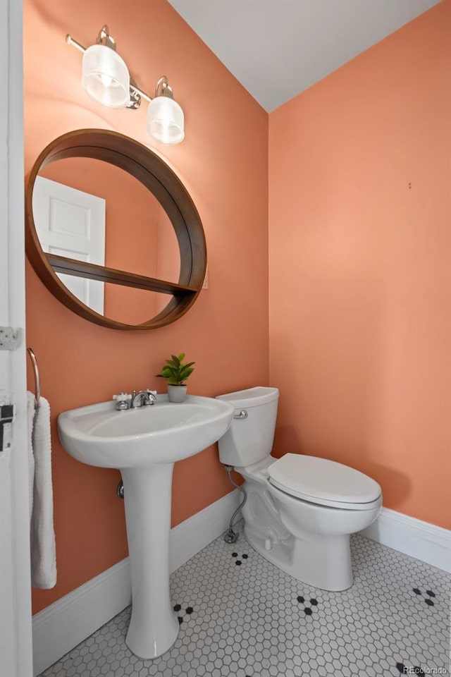 bathroom with tile patterned flooring and toilet