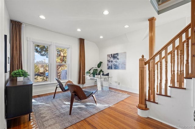 home office featuring hardwood / wood-style flooring and ornate columns