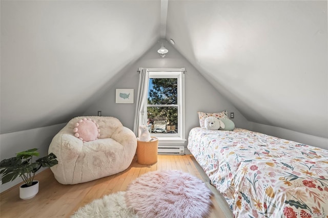 bedroom featuring lofted ceiling, light hardwood / wood-style flooring, and a baseboard radiator