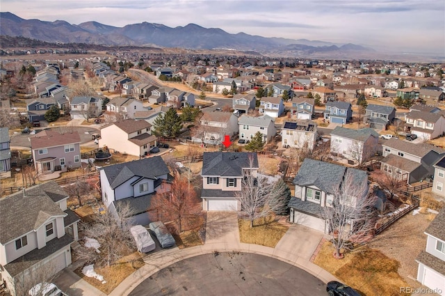 birds eye view of property with a mountain view