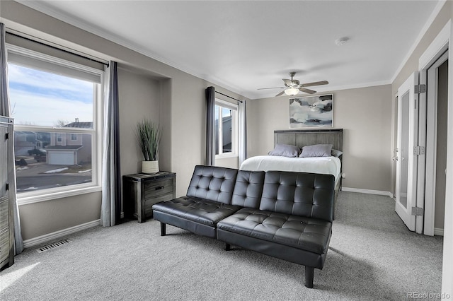 bedroom featuring ornamental molding, carpet floors, and ceiling fan