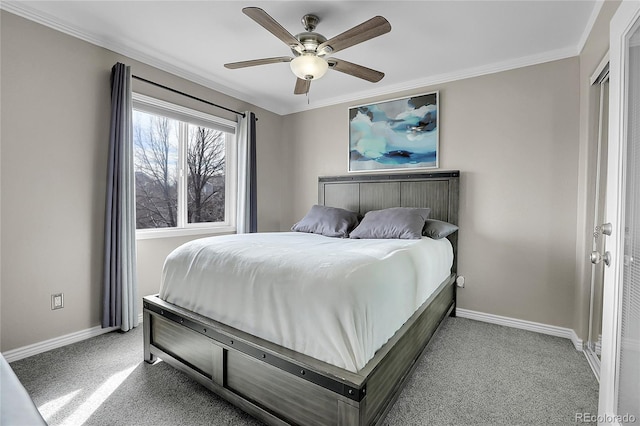 carpeted bedroom with crown molding and ceiling fan