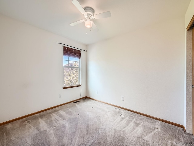 spare room with carpet flooring and ceiling fan