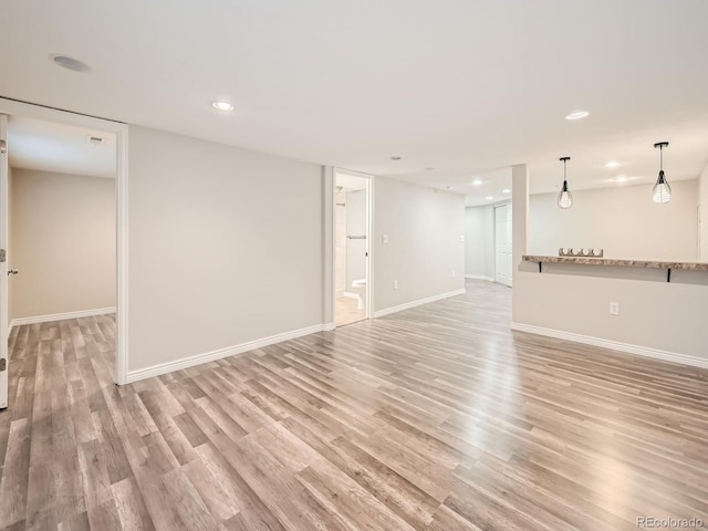 unfurnished living room featuring light hardwood / wood-style flooring