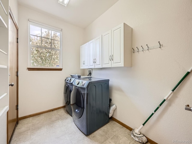 laundry room with cabinets and washing machine and dryer