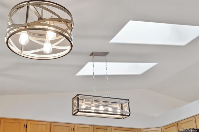 interior details with a notable chandelier and a skylight